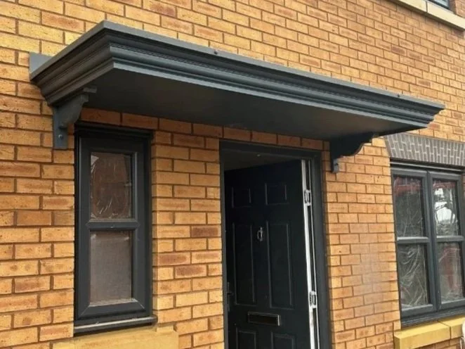 black decorative ornate flat door canopy
