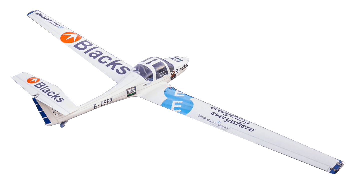 Model glider airplane with branding and advertising decals on wings, propeller, and fuselage, isolated on black background.