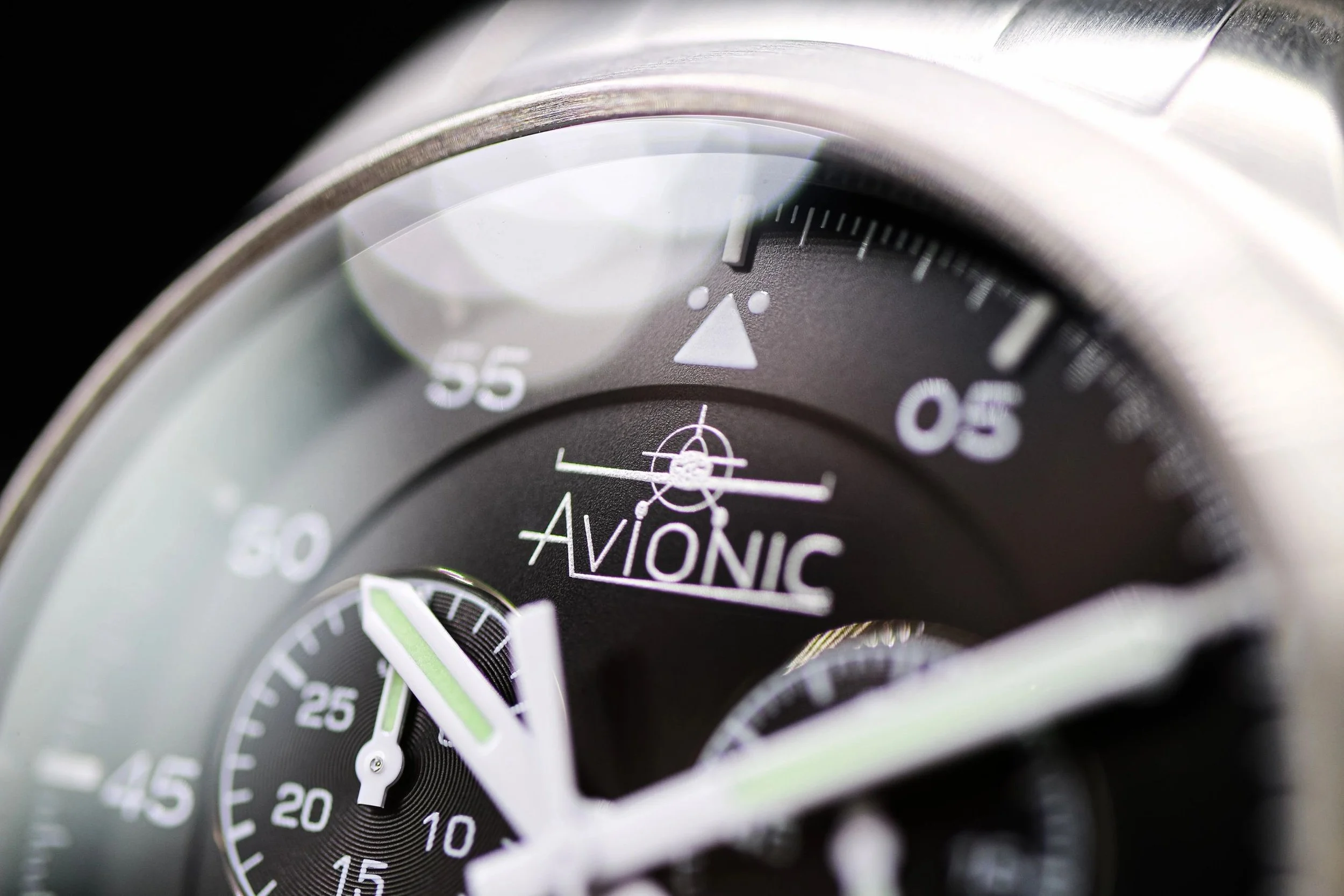 Close-up of an AviOnic watch face showing time with chronograph dials