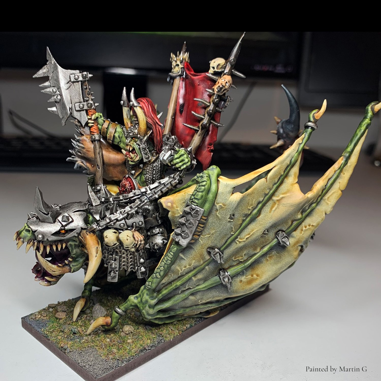 Orc Warlord mounted on Wyvern STL miniature in 28mm scale, painted example showcasing detailed wings, armor textures and dramatic battlefield presence. Designed for high-resolution resin 3D printing and Old School fantasy armies.