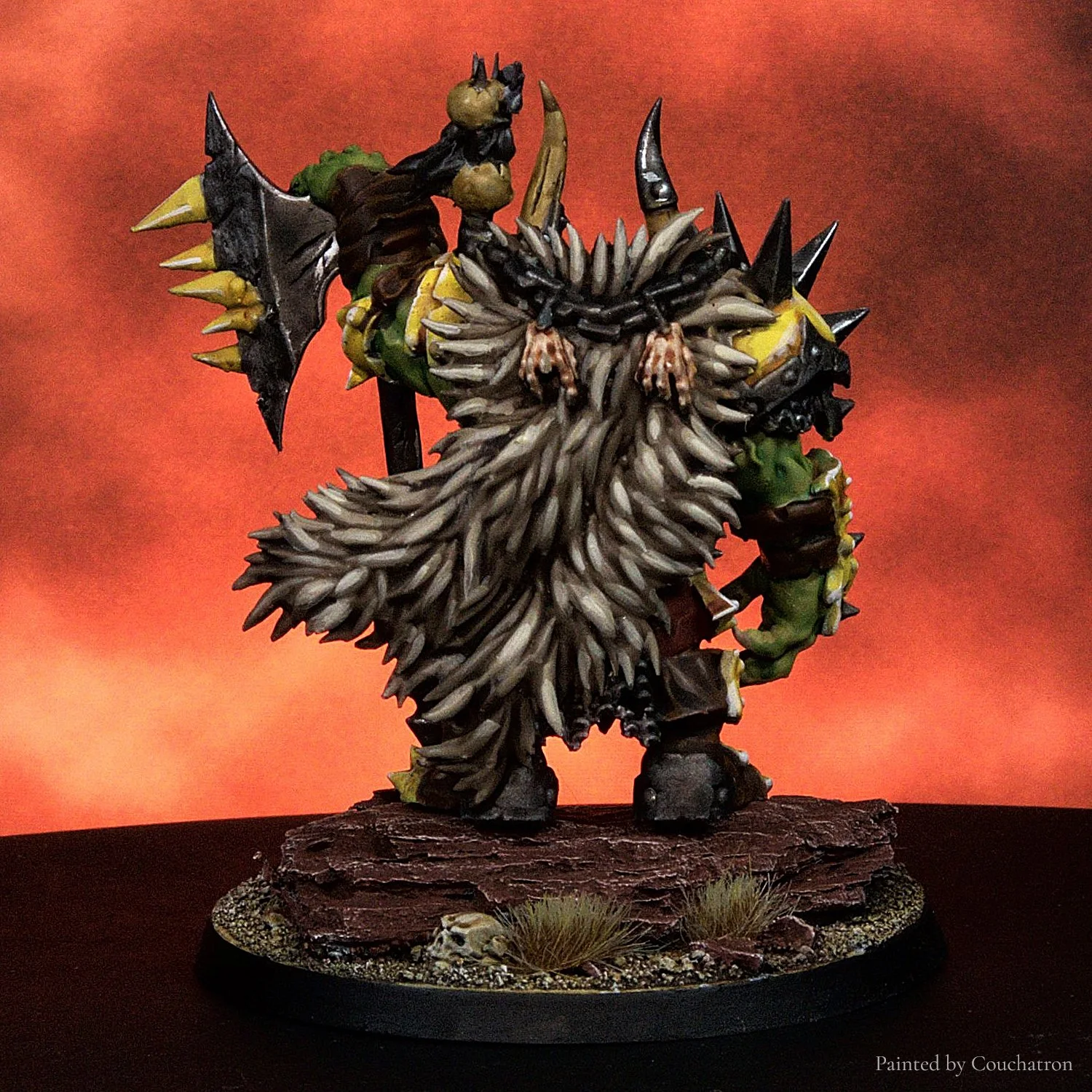 Rear view of a painted Orc Warlord 28mm STL miniature, showcasing sculpted cloak movement, layered armor and high-detail textures. Designed for high-resolution resin 3D printing and compatible with traditional fantasy armies.