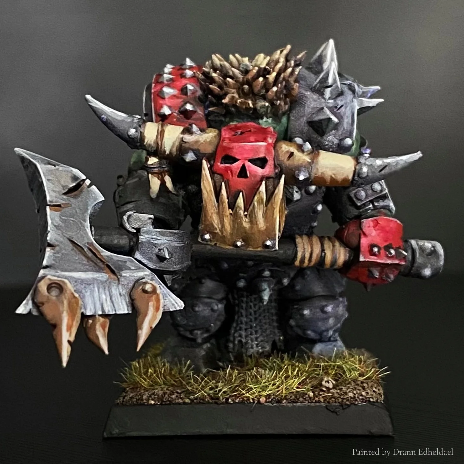Iron Orc warrior STL miniature in 28mm scale, painted example showcasing detailed armor plates, battle-worn textures and powerful stance. Designed for high-resolution resin 3D printing and Old School fantasy wargames.