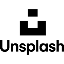 Black logo with a geometric smiley face and the word 'Unsplash' below it.