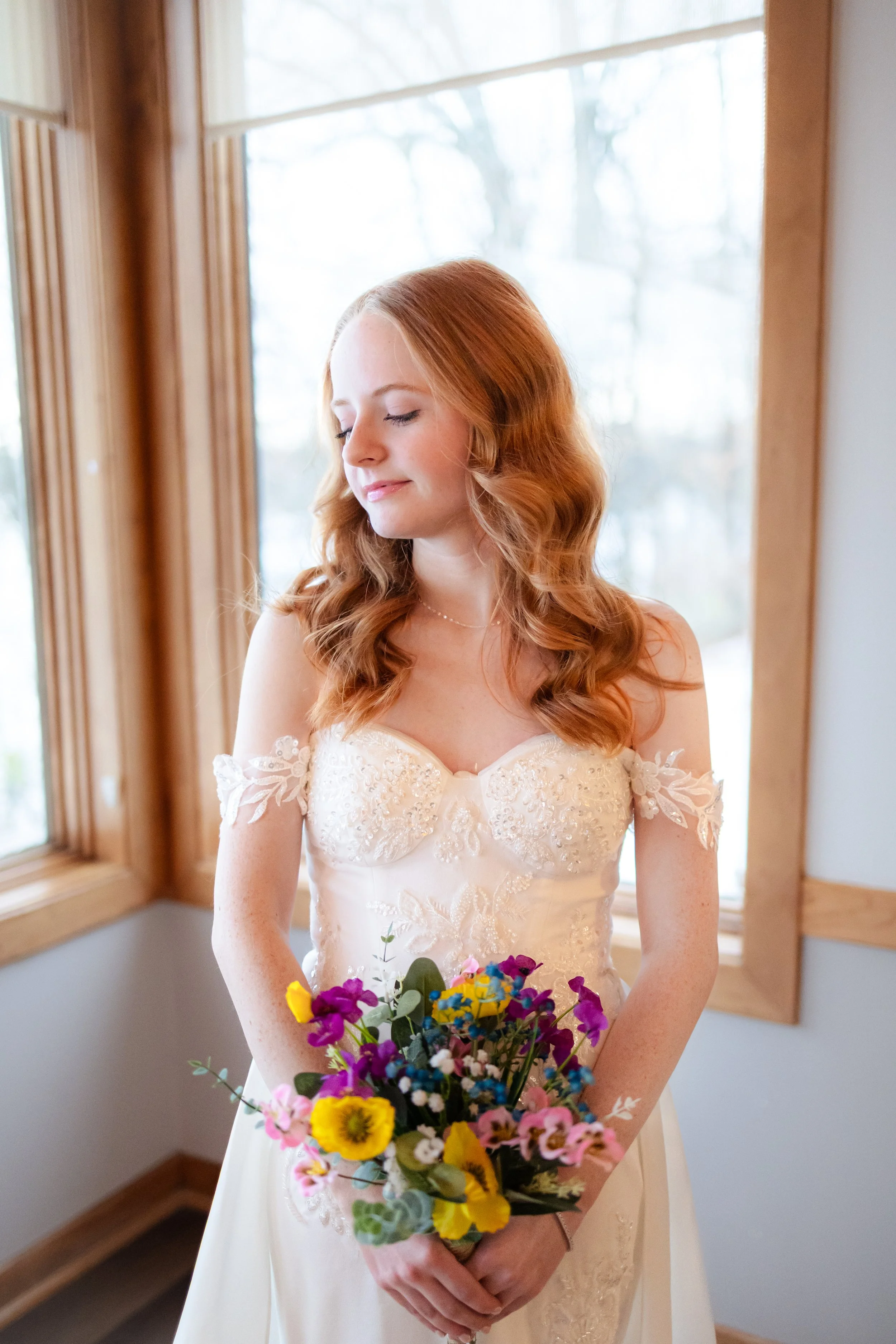 Bride posing for bridal portraits during winter wedding captured by wedding photographer in Noblesville, Indiana
