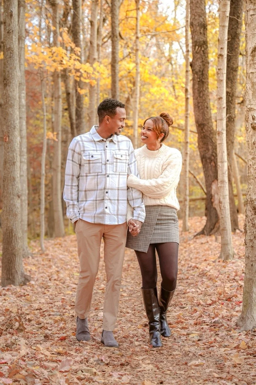 Indianapolis couple during anniversary photography session in the fall season posing in fall foliage