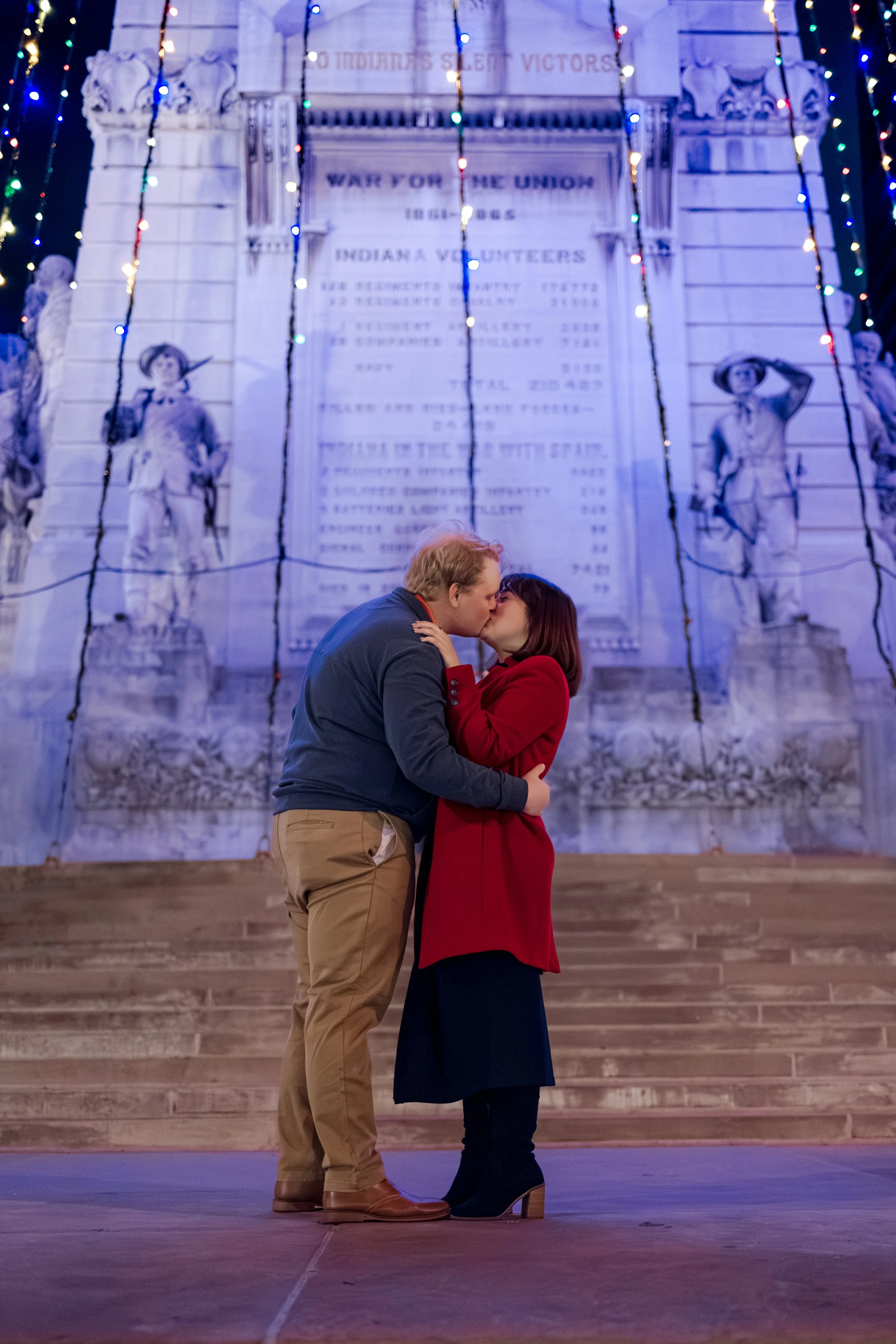 Indianapolis engaged couple celebrate after proposal captured by engagement photographer at Soldiers and Sailors Monument in Downtown Indianapolis
