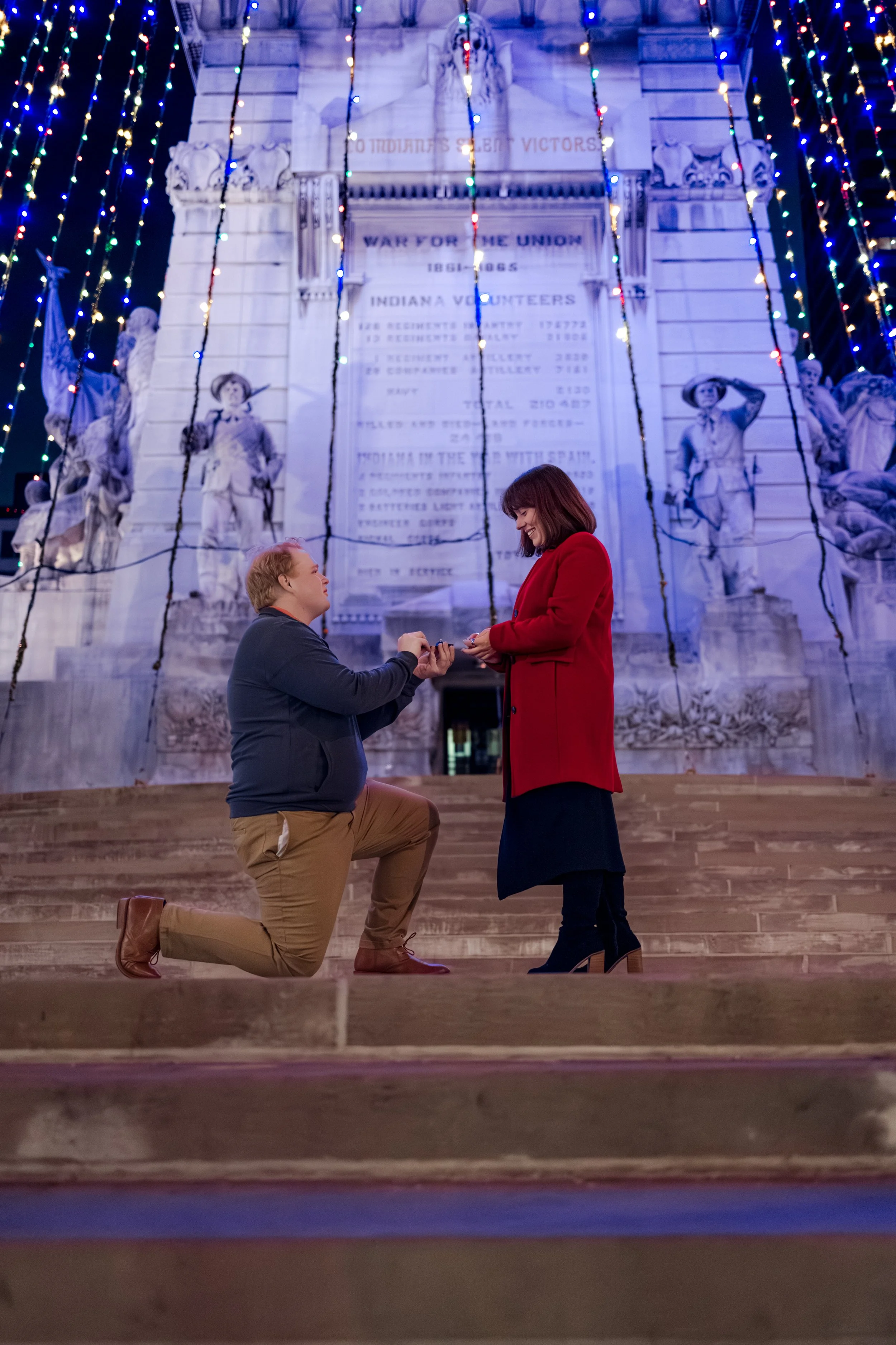 Man proposing to woman at Soldiers and Sailors Monument in Downtown Indianapolis captured by Proposal Photographer