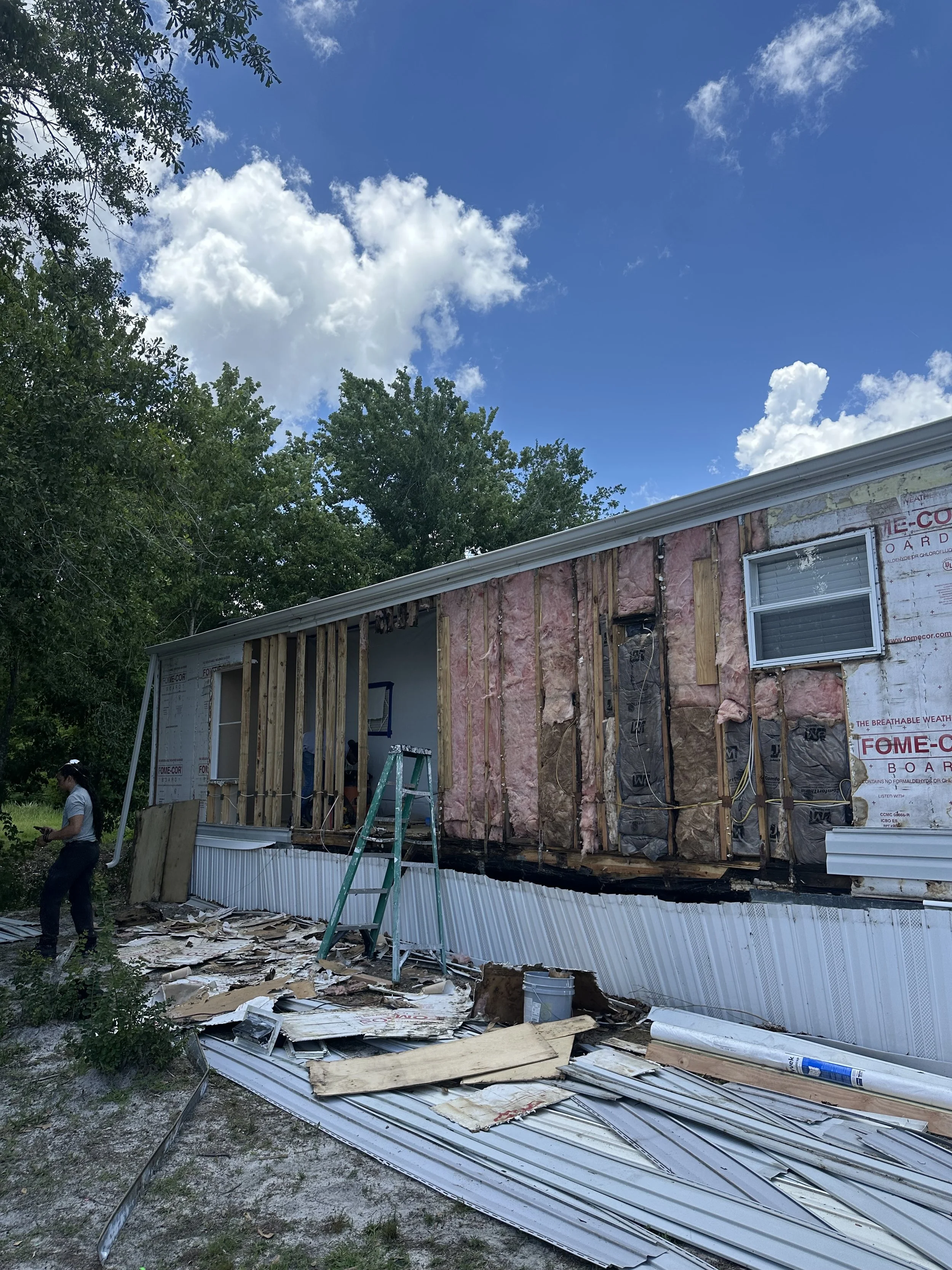 Central Florida home under reconstruction with exposed exterior wall framing after water damage repair