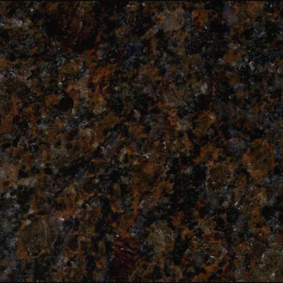 Close-up of a polished granite surface with a dark brown, black, and reddish pattern.