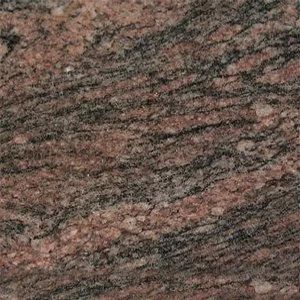 Close-up of a textured granite surface with pink and black mineral patterns.