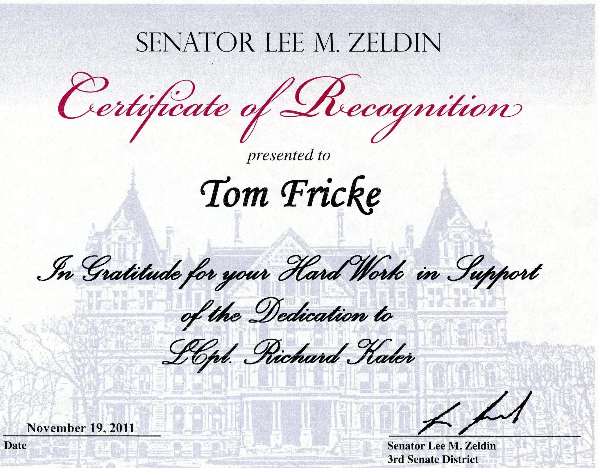 Certificate of Recognition awarded to Tom Fricke, presented by Senator Lee M. Zeldin, dated November 19, 2011, for supporting hard work and dedication.