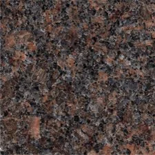 Close-up of a speckled granite countertop with black, brown, and gray tones.