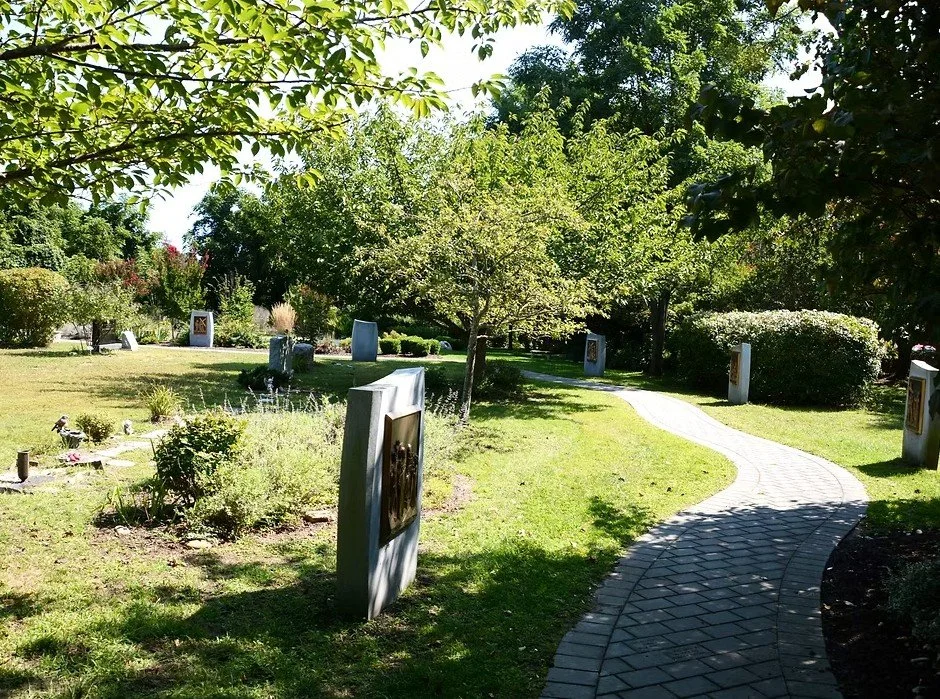 paver pathway with station of the cross monuments