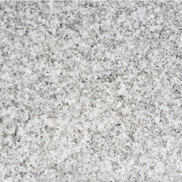 Close-up of a light gray, speckled granite surface.