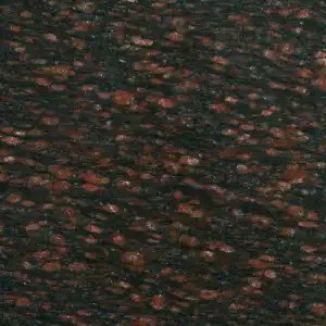 Close-up of a dark, textured surface with reddish-brown and black streaks.