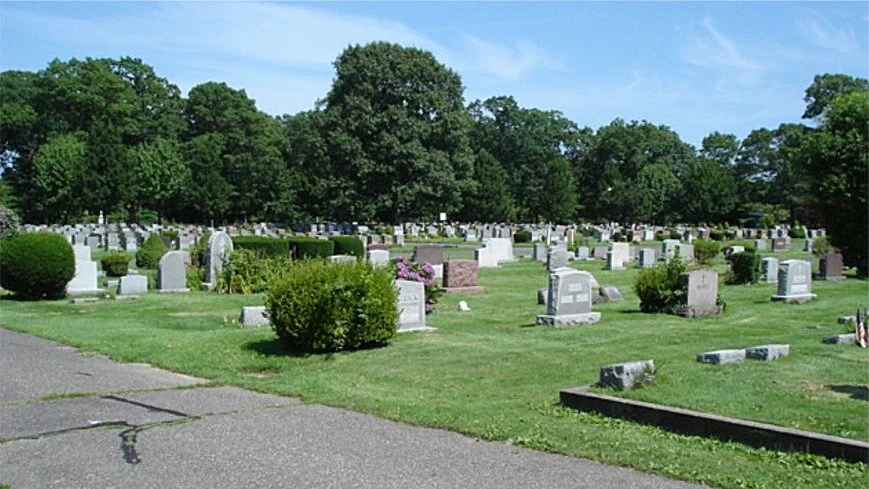 cemetery with grave stones in row in colors of grey and pink