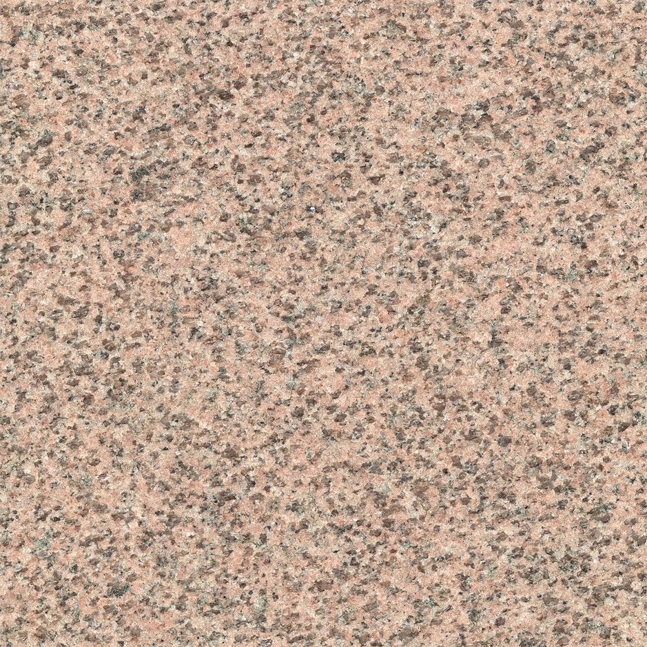 Close-up of a pink granite surface with small black and gray speckles.