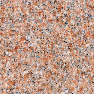 Close-up of a speckled granite surface with pink, black, and white mineral grains.
