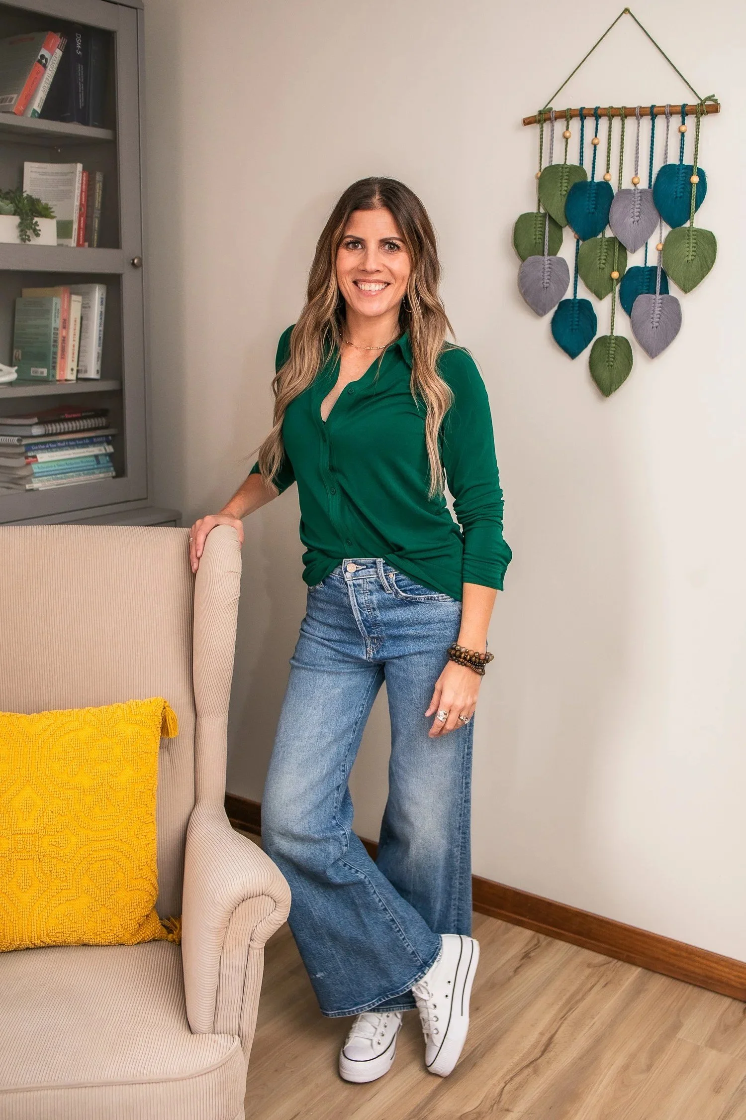 Angela Langer, LICSW, ADHD therapist and coach for women, standing in her Red Wing, Minnesota office