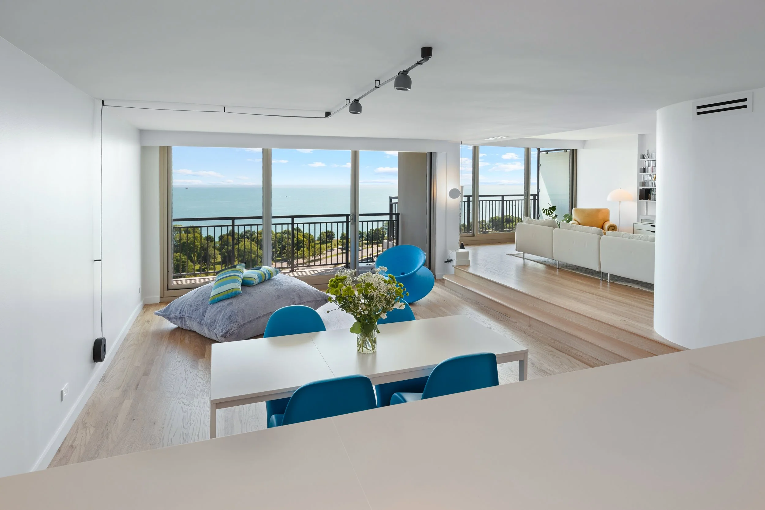 Turnkey luxury condo renovation with open living area and floor-to-ceiling windows in Streeterville Chicago condo.