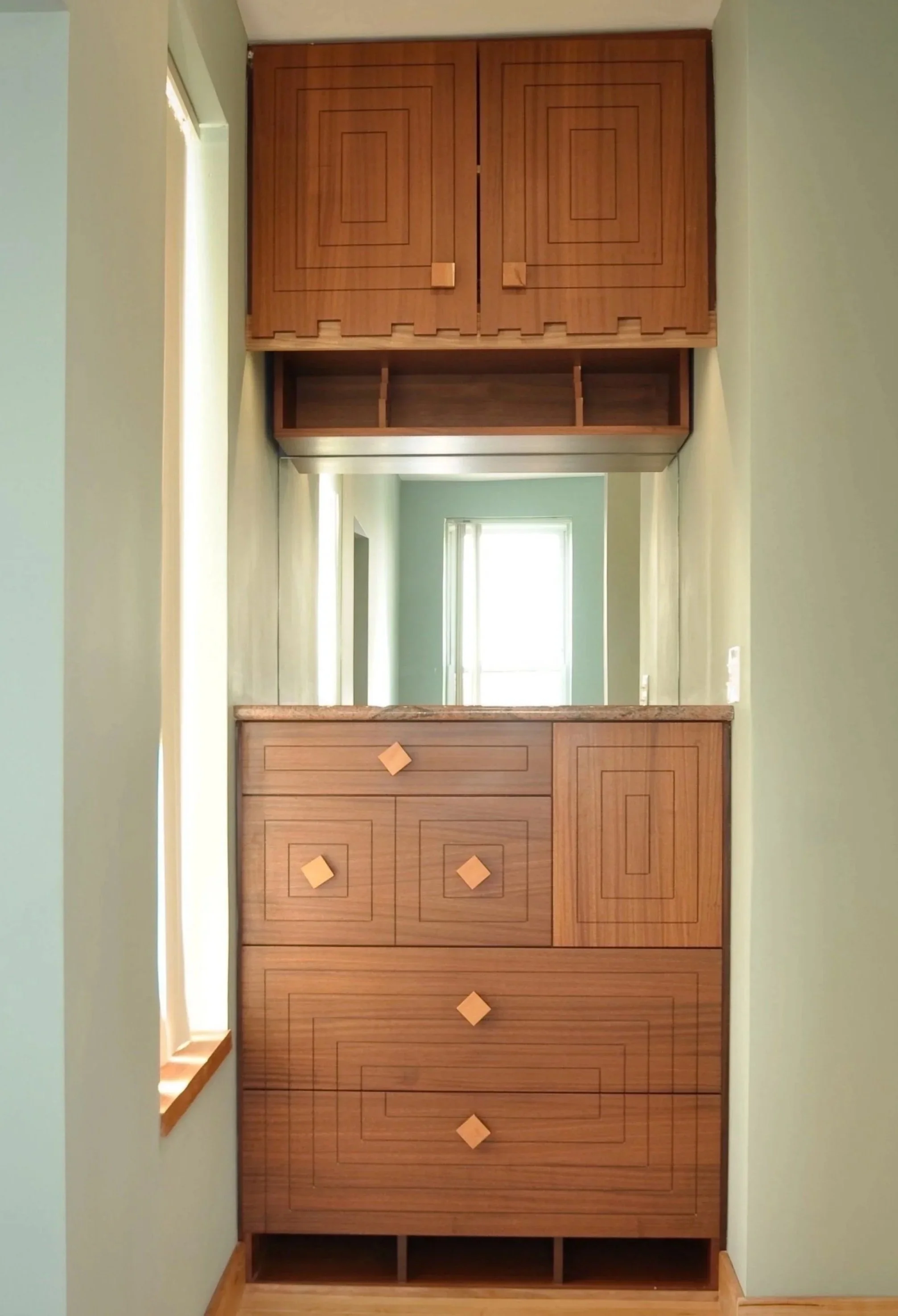 Custom wood nook cabinet and vanity fabrication for architectural home interior in Evanston IL.