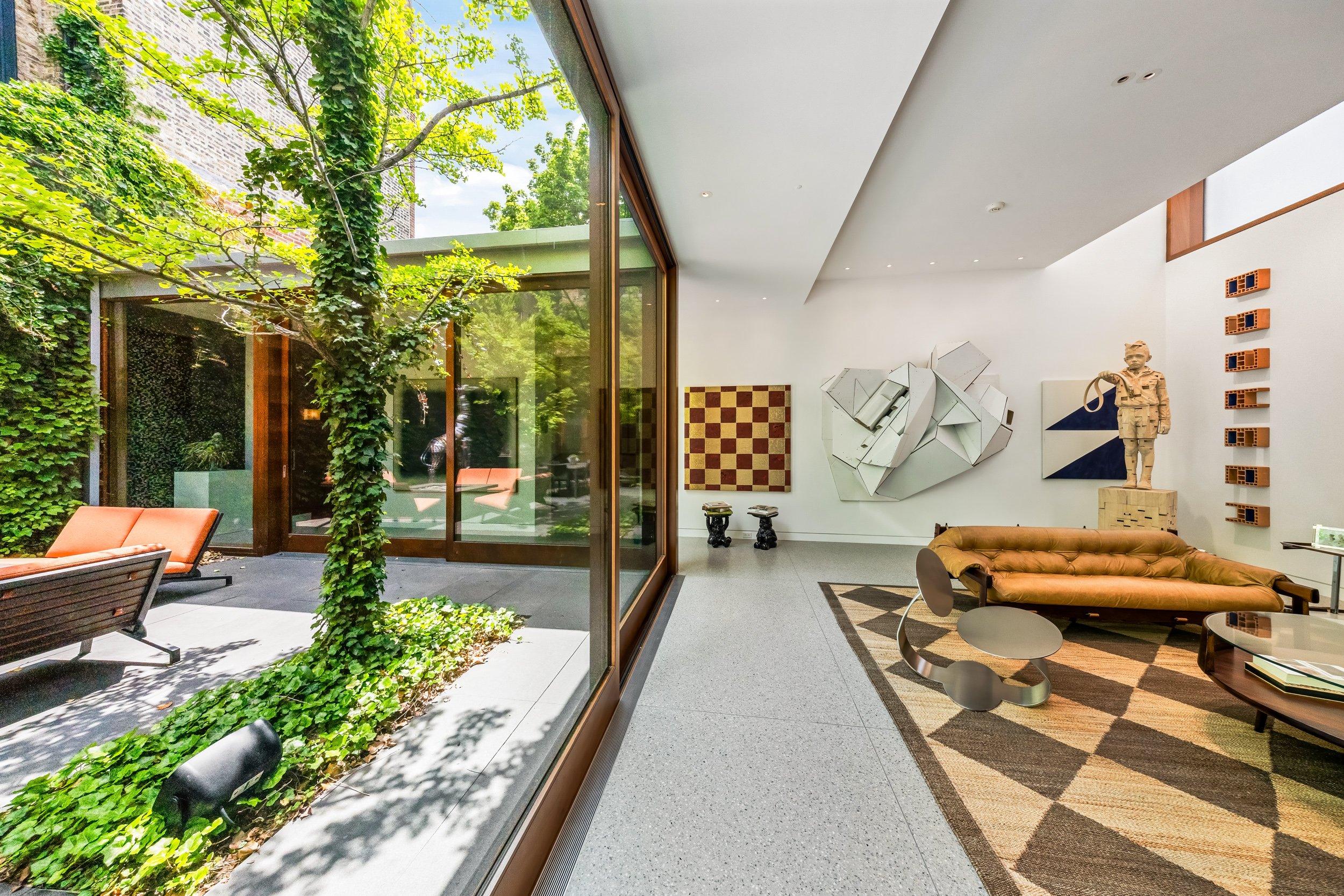 Modern full-home architectural build with interior courtyard access and custom floor-to-ceiling windows in Bucktown Chicago.