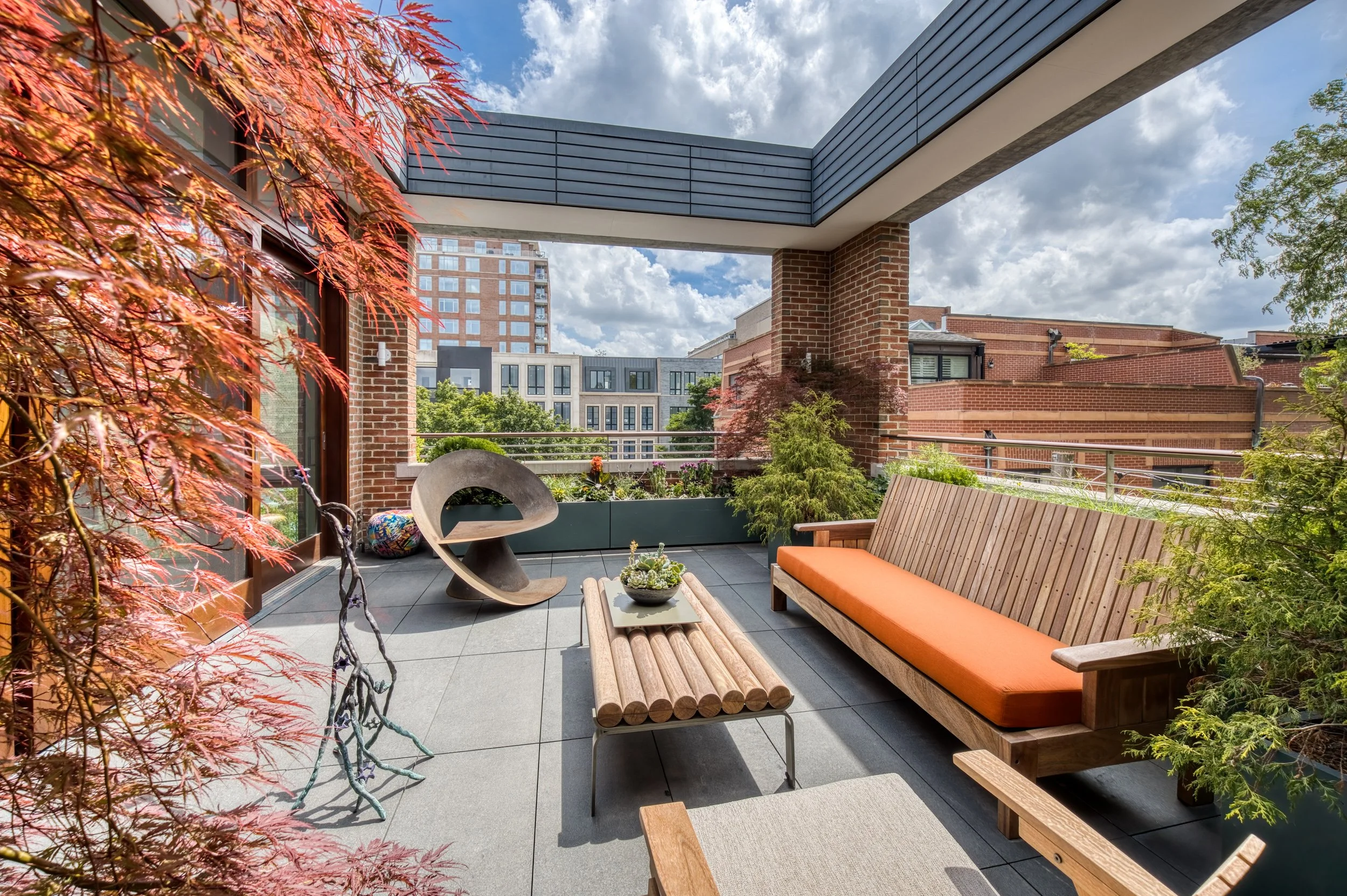 Rooftop terrace construction featuring custom wooden bench seating and cedar framing in Bucktown Chicago.