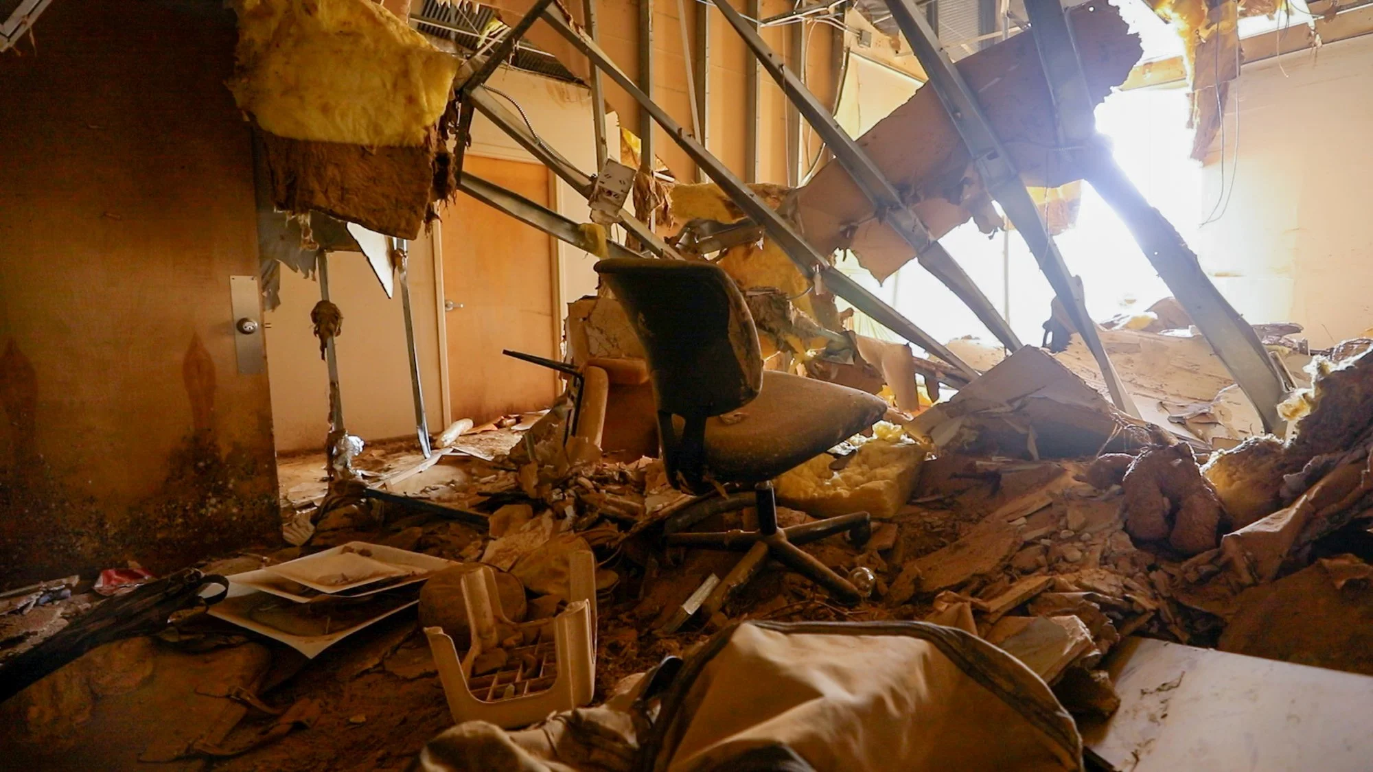 A mental health office in Asheville, North Carolina, sits in shambles after floodwaters from the nearby French Broad River surged through the space.