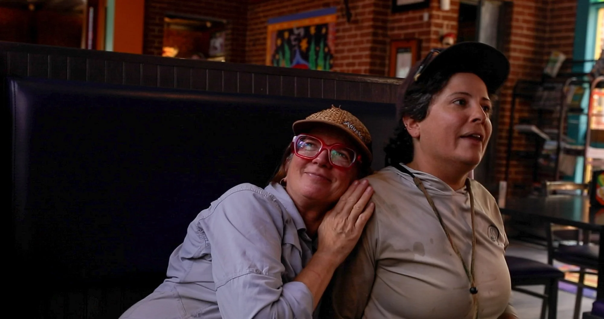 Mandy Wallace lovingly leans on Leslie Beninato during their lunch break at Mellow Mushroom. A quiet moment that reflects the deep bond the team has formed through their time together.