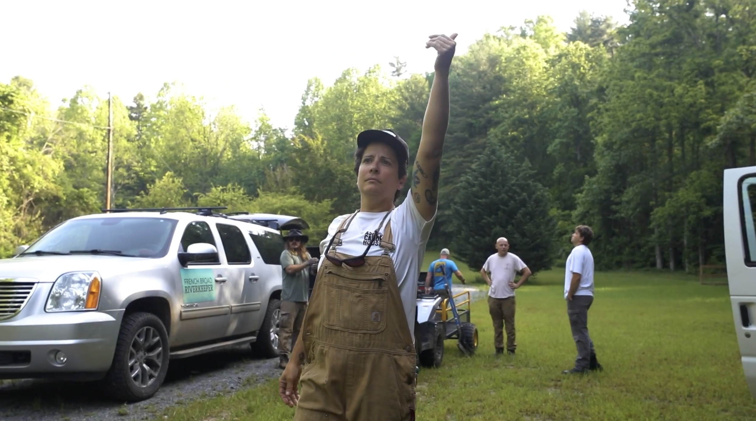 Leslie Beninato directs a cleanup crew’s excavator before the start of their morning debris removal efforts.