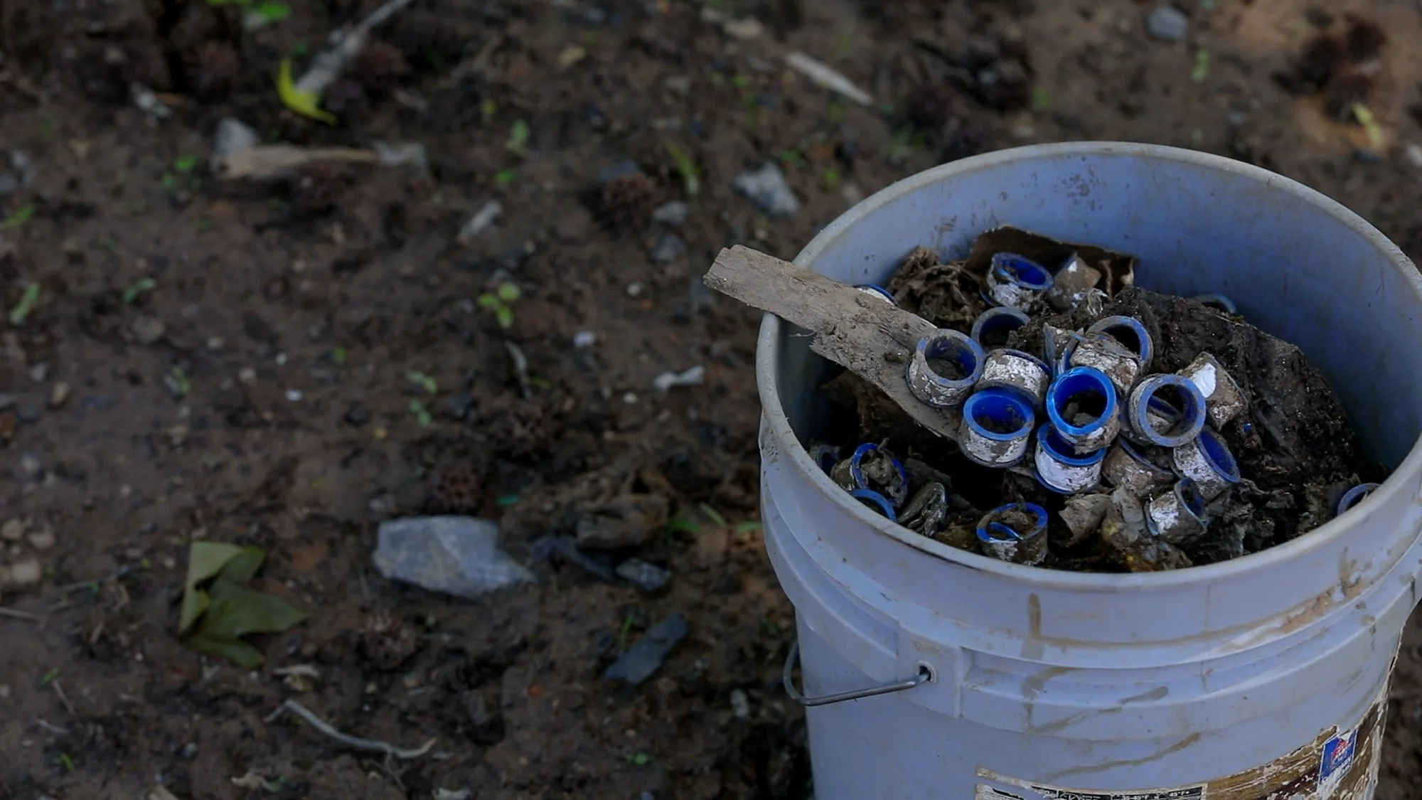 A bucket filled with handpicked trash brought down the French Broad district from a local Lowes that was destroyed by the hurricane. The flooding swept away tons of PVC sewage piping, scattering debris throughout the area.
