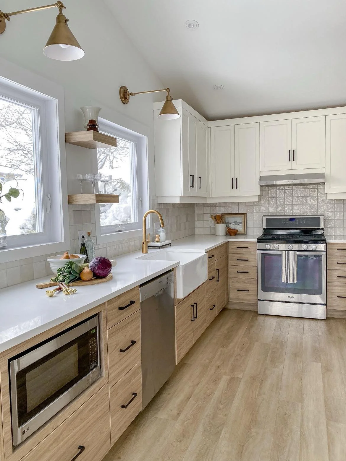 Full kitchen renovation warm wood lower cabinets white uppers Kanata Ottawa