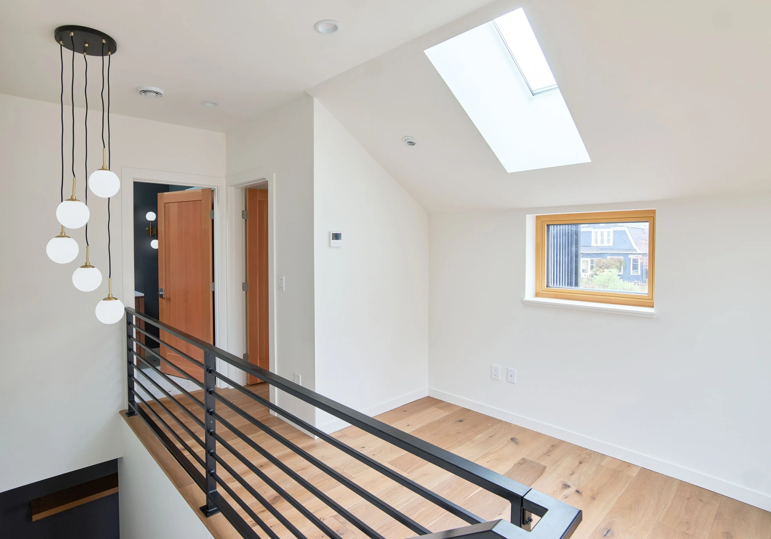 upper-landing-skylight-globe-pendants-dadu-bellingham.jpg