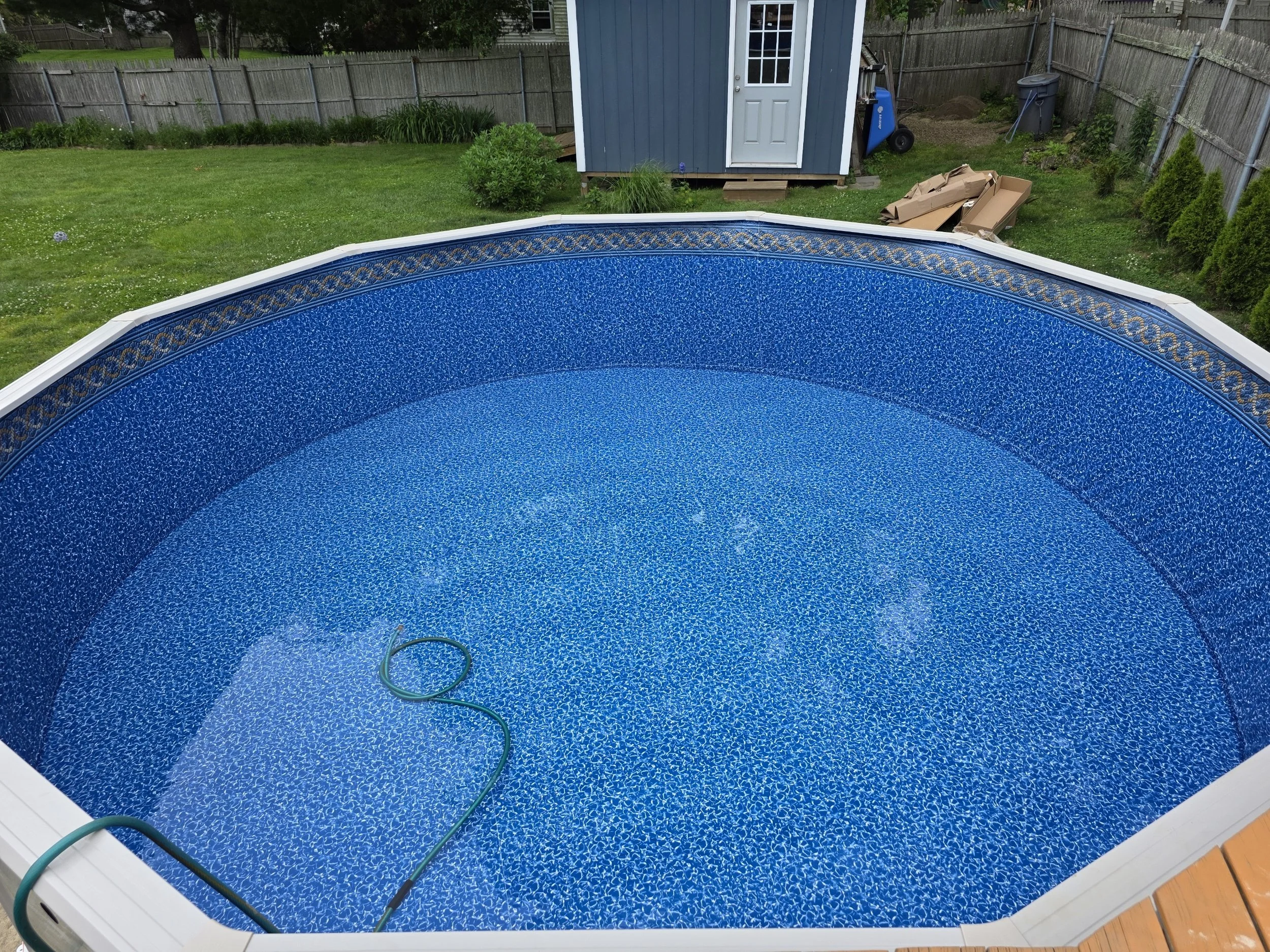 A brand new 18ft round above ground pool installed by All American Pools and Spas.
