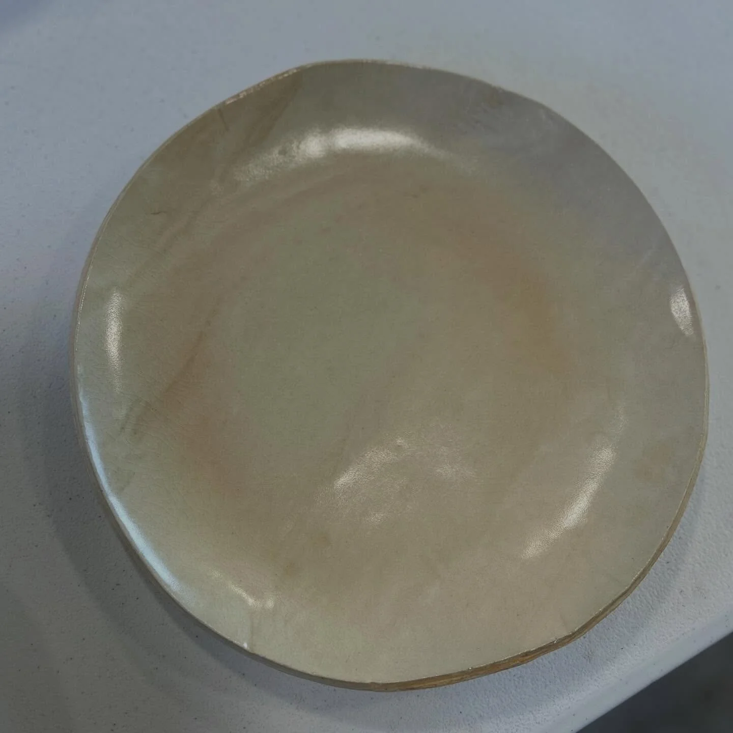 Reclaimed clay left not completely mixed. I love it! The glaze crazed a bit but the subtle shifts in color are working for me!