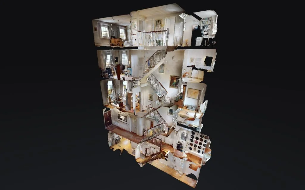 3D walkthrough of a multi-story house interior showing rooms, staircases, and furnishings.