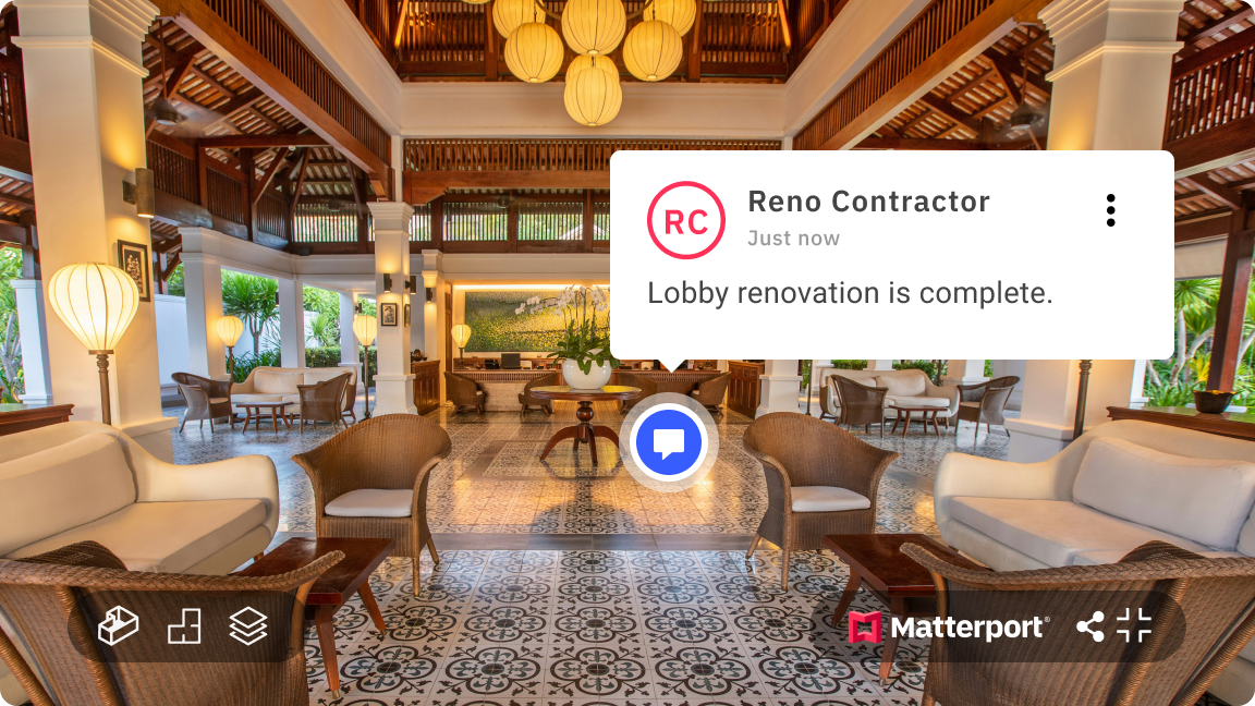 Luxurious hotel lobby with high ceilings, wooden balconies, white columns, and tropical plants. The space is decorated with cream and brown furniture, hanging paper lanterns, and patterned floor tiles.