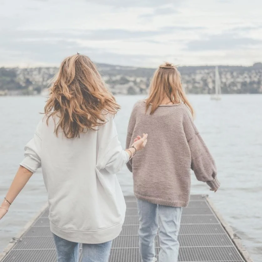 women walking peir