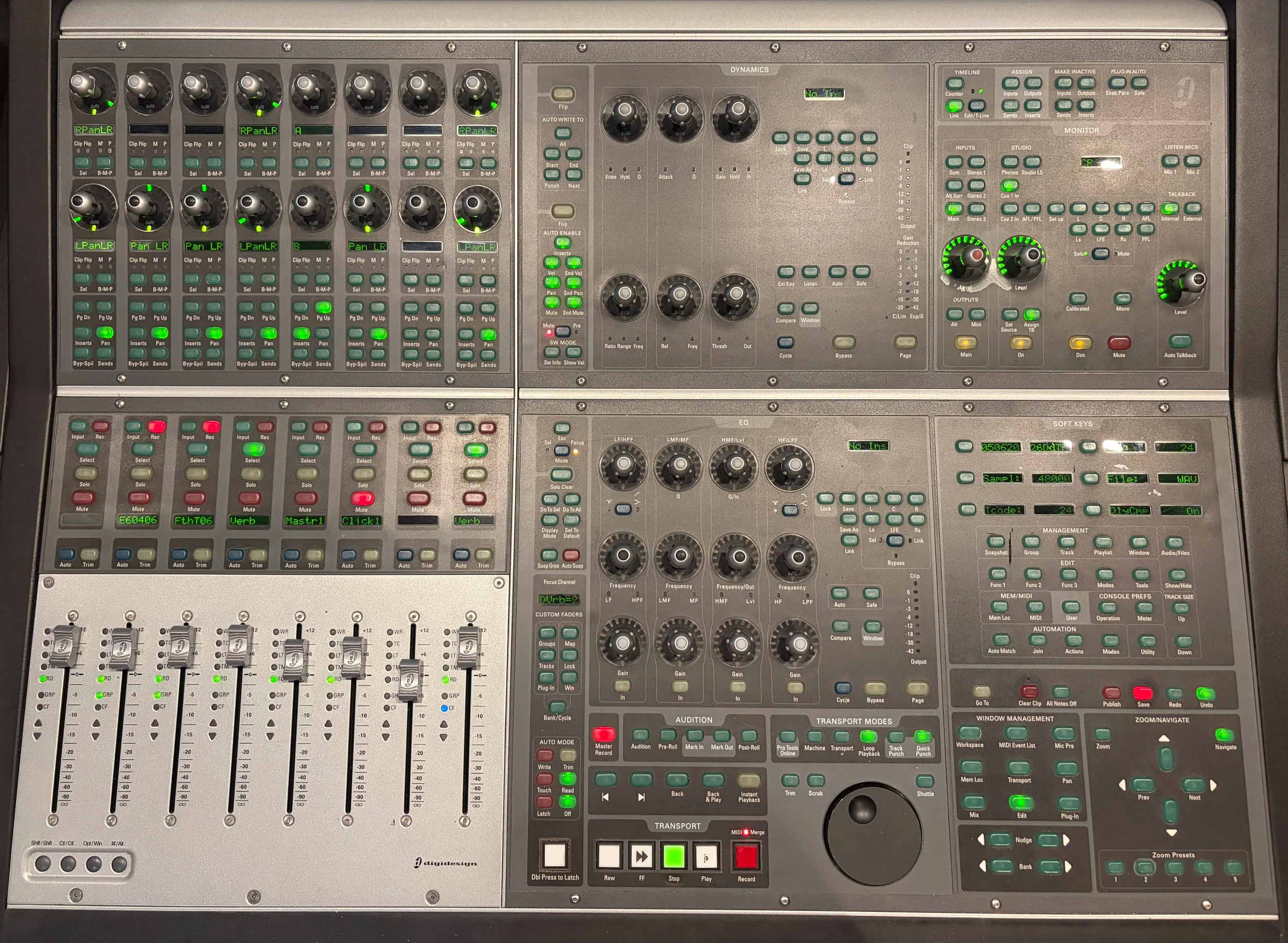 A sound mixing console with numerous knobs, sliders, and buttons, used for audio production and mixing.
