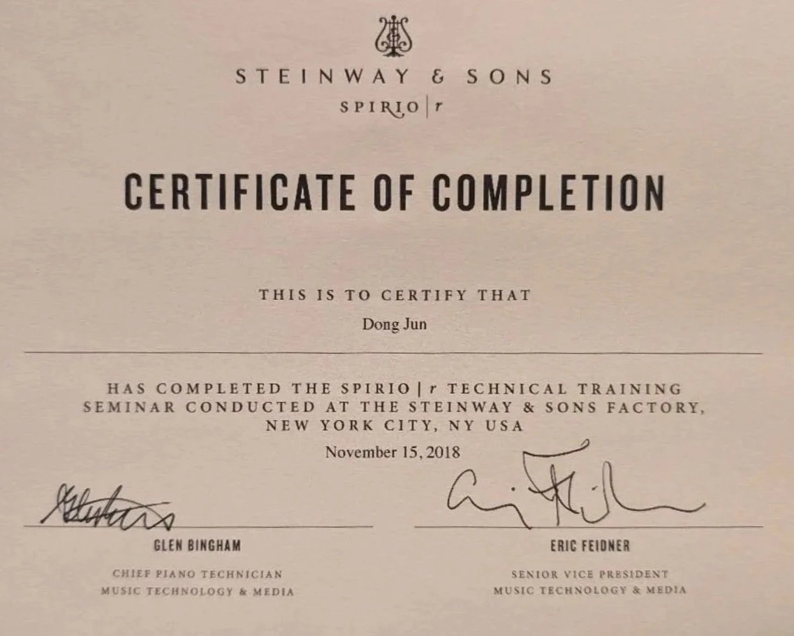 Certificate of completion awarded to Dong Jun for the Spirio|r technical training seminar held at Steinway & Sons factory in New York City on November 15, 2018, signed by Glen Bingham and Eric Feidner.