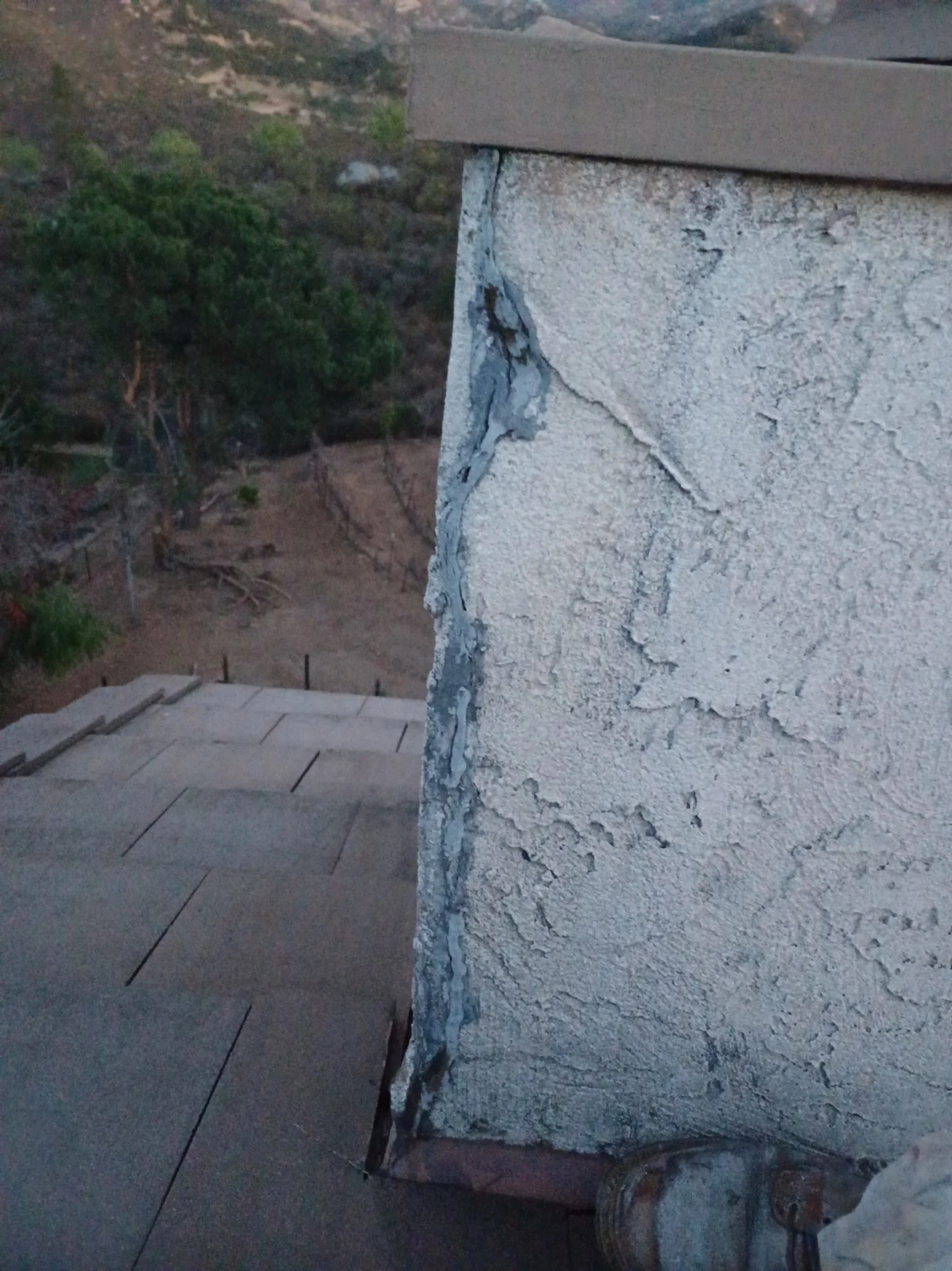 Close-up of a damaged stucco before in Rancho Bernardo