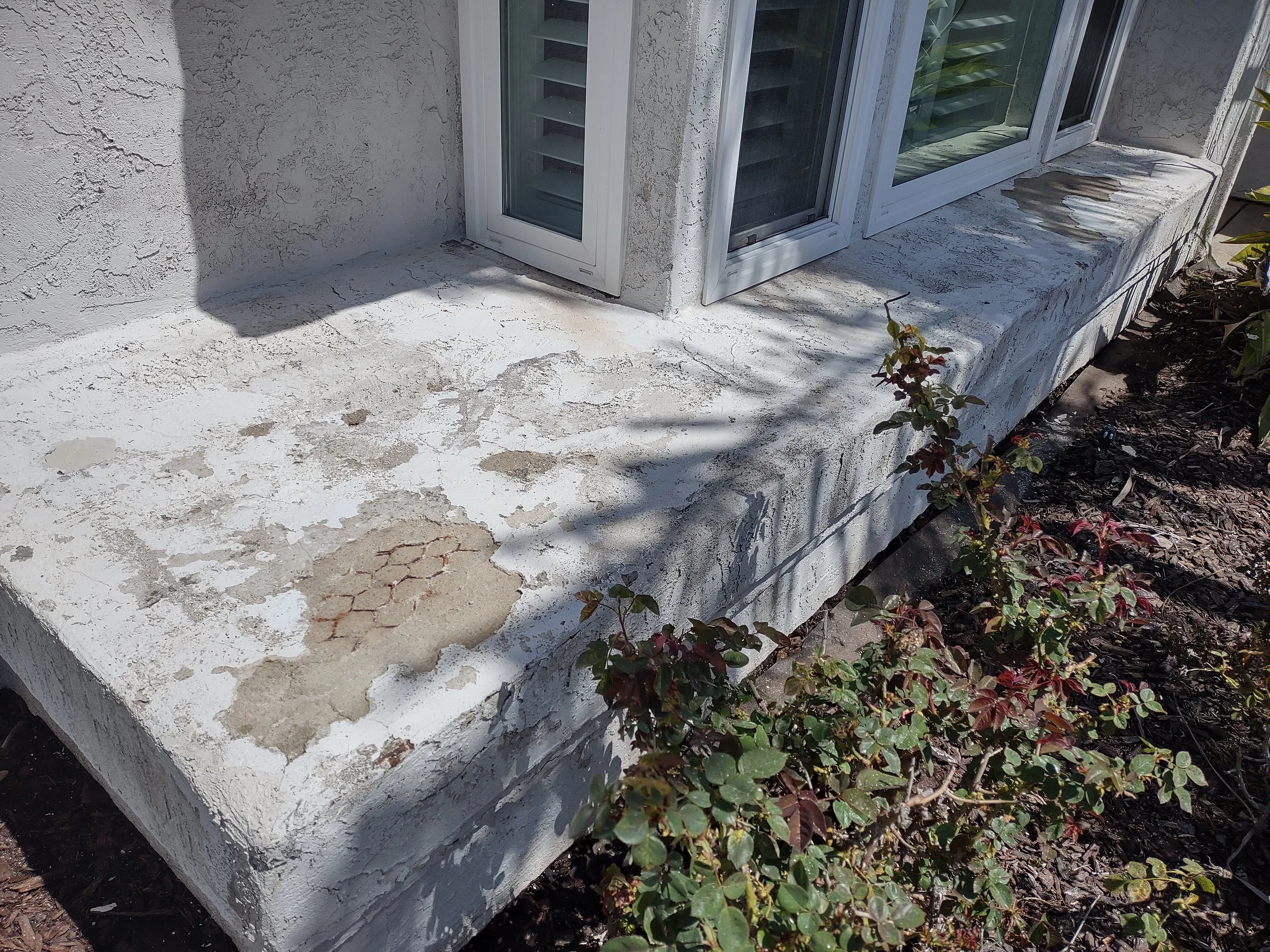 Stucco damage Before in Carlsbad