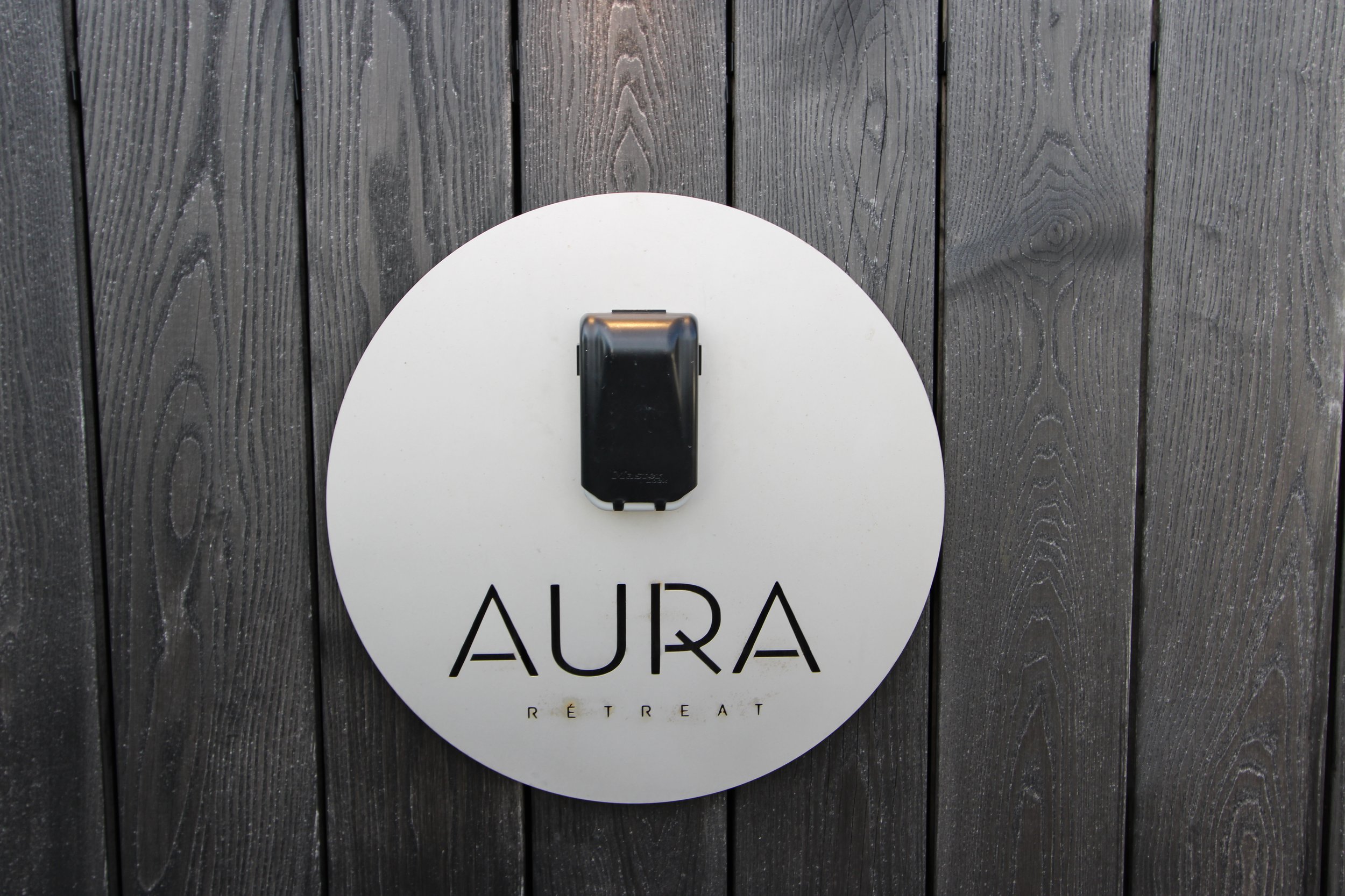 aura retreat sign.JPG