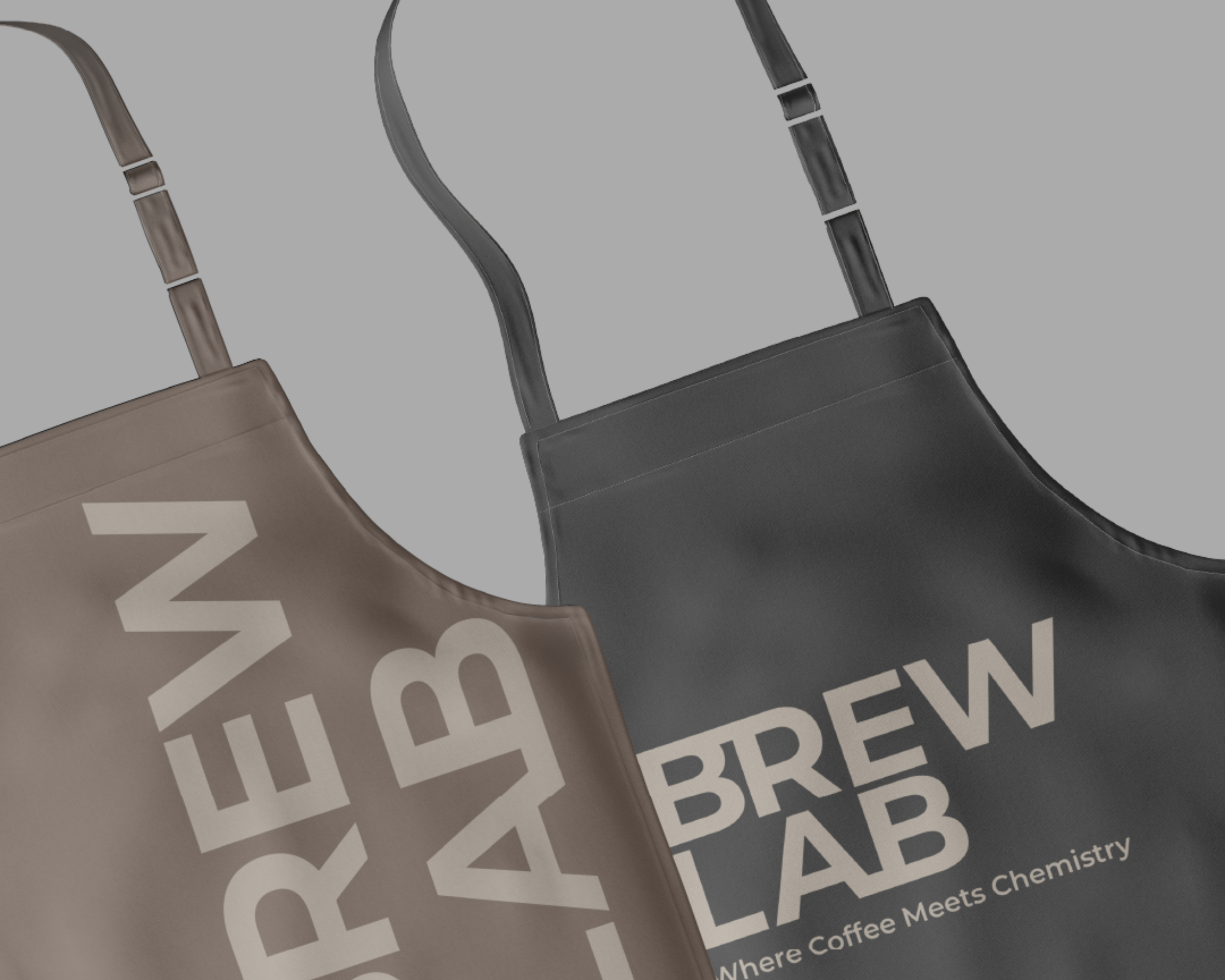 Brew Lab branded café aprons as part of the visual identity