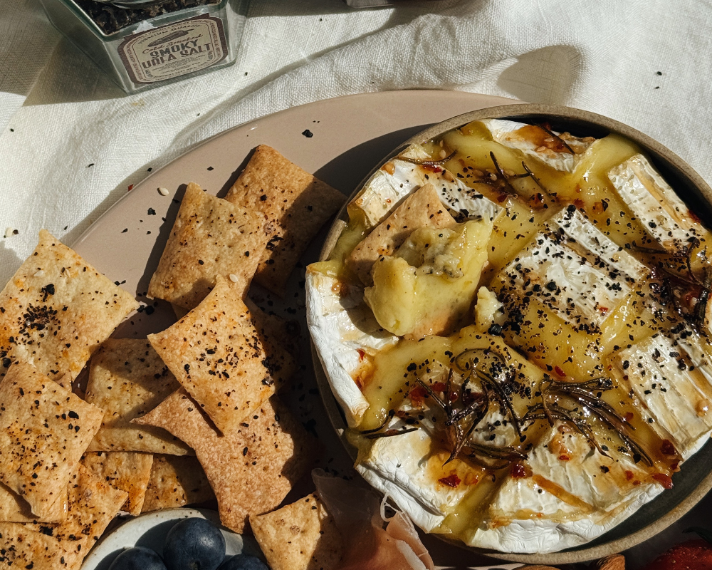  Crackers next to baked brie 