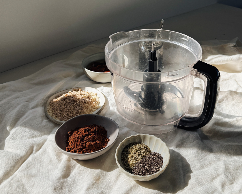 Food processor with dry ingreientds around it.png