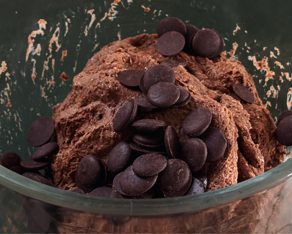  Close up of dough and chocolate buttons for chocolate cherry hot cross buns  