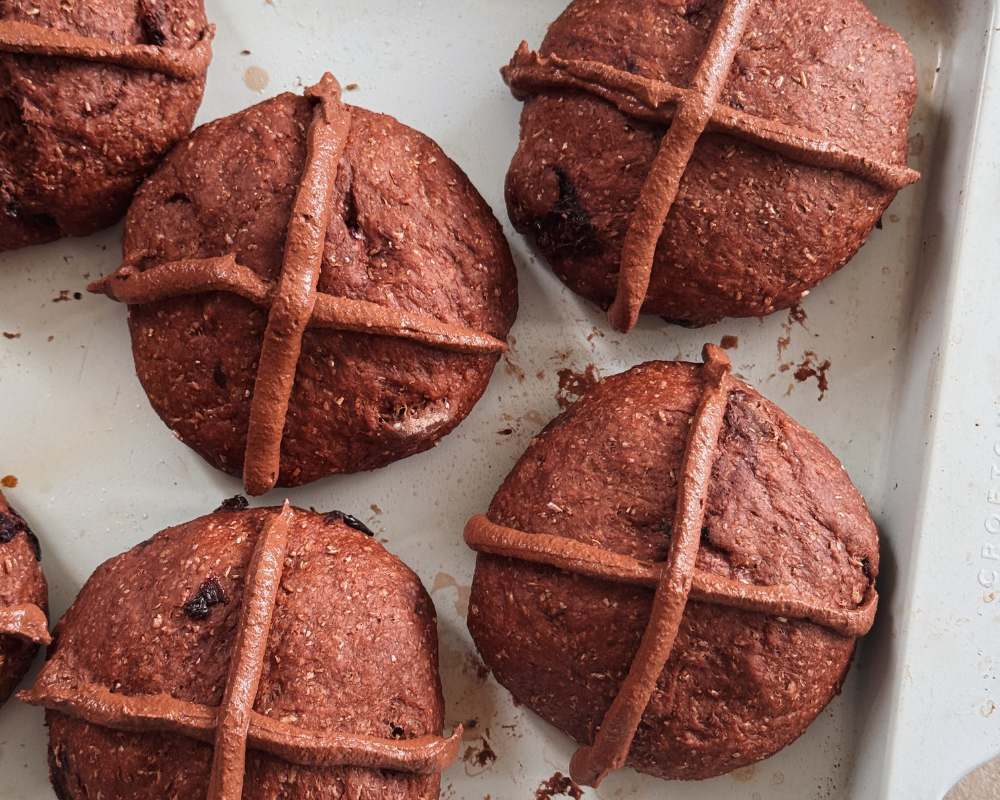  Chocolate cherry hot cross buns piped with crosses, ready to be baked 