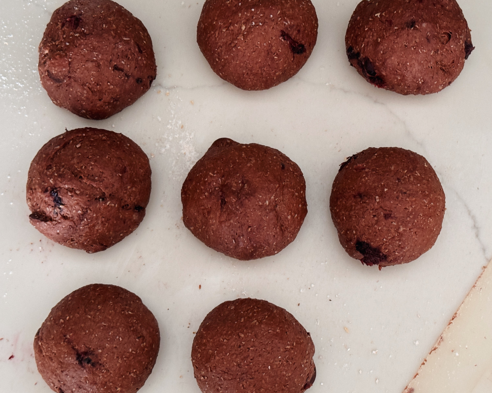  Dough rolled into 8 balls for chocolate cherry hot cross buns  