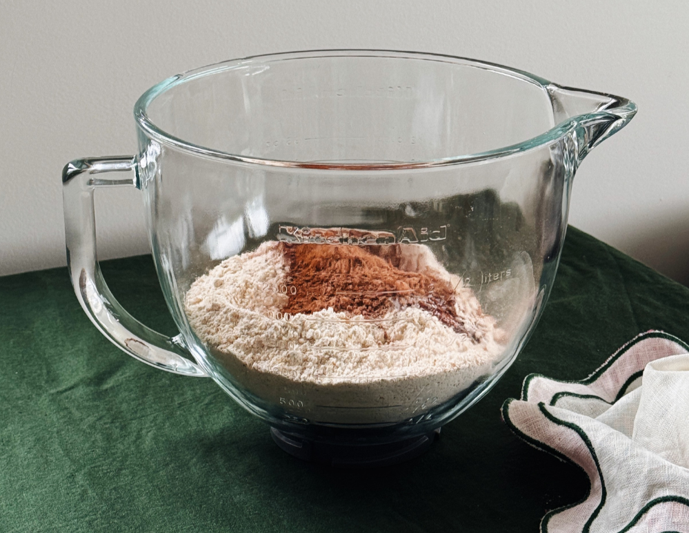  Dough and cocoa powder in a mixing bowl for chocolate cherry hot cross buns  